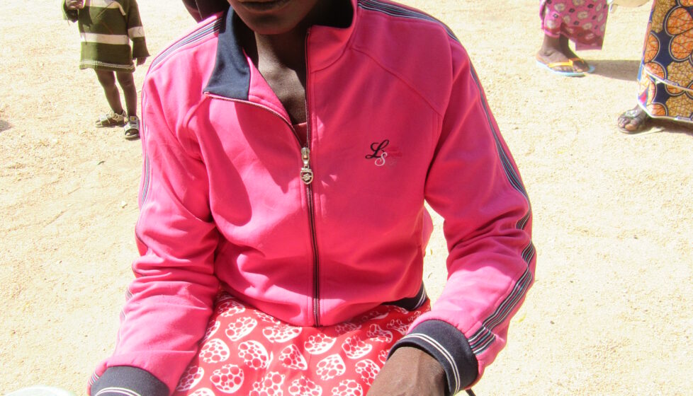 Nigerian girl sits reading her bible